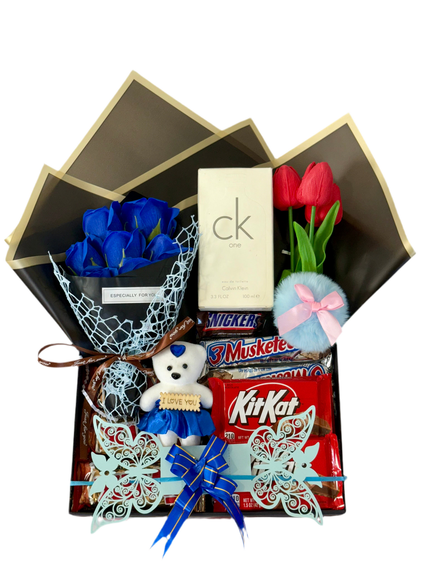 Gift basket with blue roses, teddy bear, KitKat bars, and other items on a white background