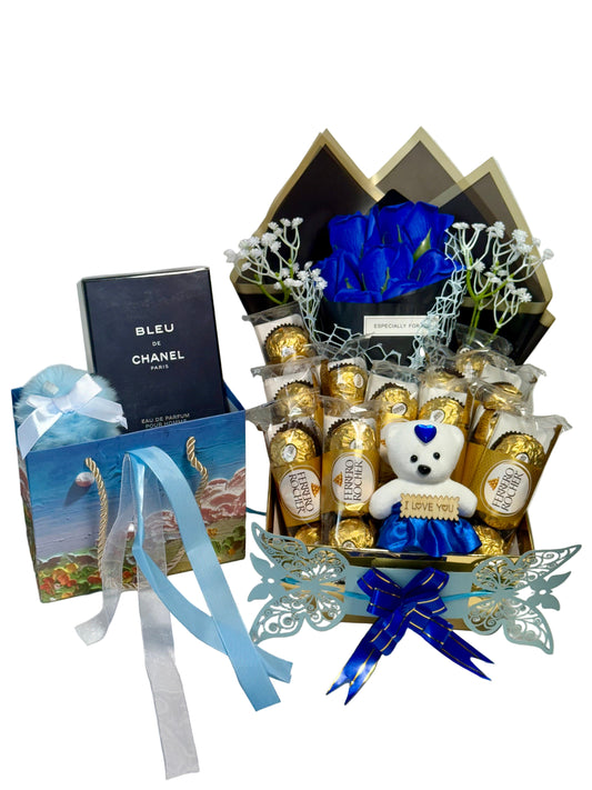Gift set with chocolates, flowers, and a teddy bear on a white background