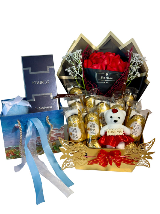 Gift basket with flowers, chocolates, and a teddy bear on a white background